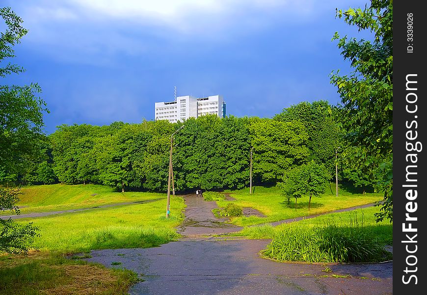 Road to big house in sunset light after rain. Shot in Dniepropetrovsk Nat'l University campus, Ukraine