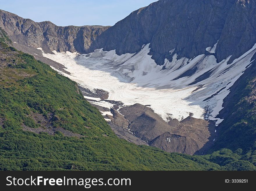 Snow in valley of Alaskan mountain. Snow in valley of Alaskan mountain.