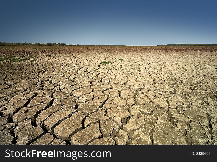 Scorched earth with blue sky