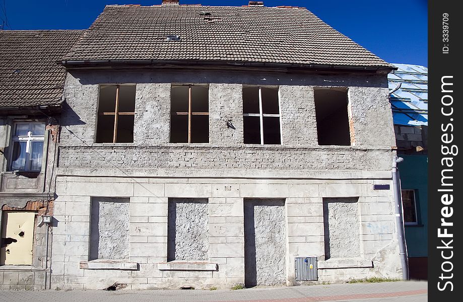 A house with its door and windows filled with concrete, abandoned. <a href=' STYLE='font-size:13px; text-decoration: blink; color:#FF0000'><b>MORE PHOTOS OF POLAND »</b></a>. A house with its door and windows filled with concrete, abandoned. <a href=' STYLE='font-size:13px; text-decoration: blink; color:#FF0000'><b>MORE PHOTOS OF POLAND »</b></a>