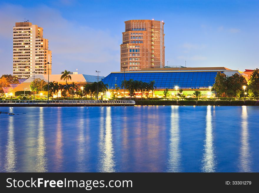 Night cityscape, Meeting hall in Thailand at dusk. View from public park.