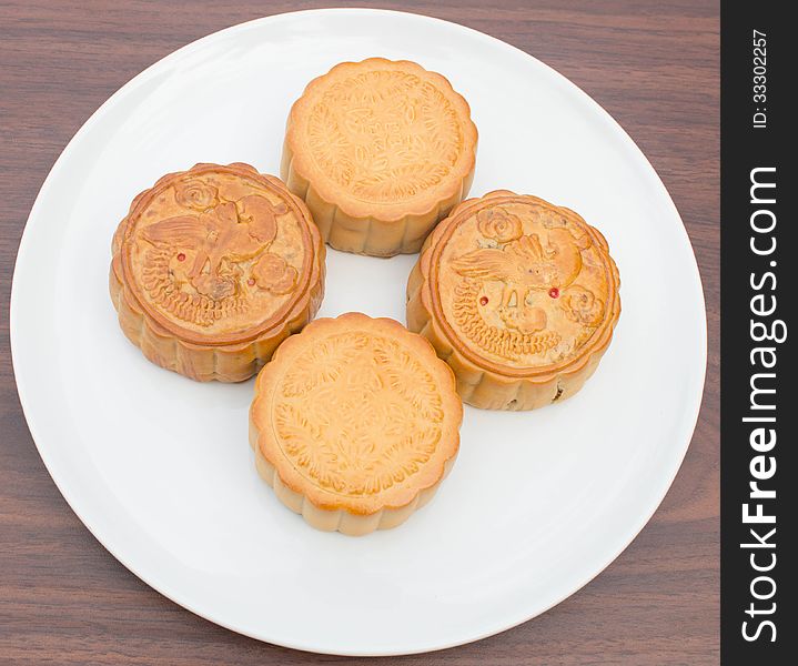 Mooncakes placed on a white plate. Mooncakes placed on a white plate.