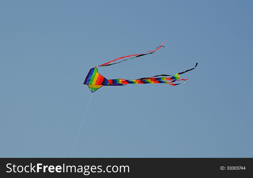 A colourful kite photographed against the summer sky. A colourful kite photographed against the summer sky