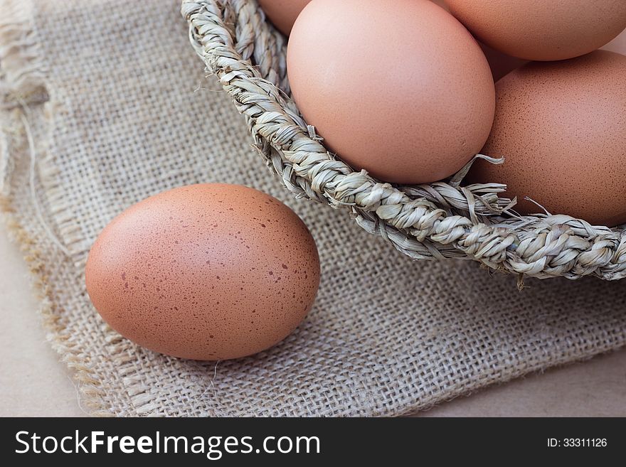 Basket with eggs on sackcloth