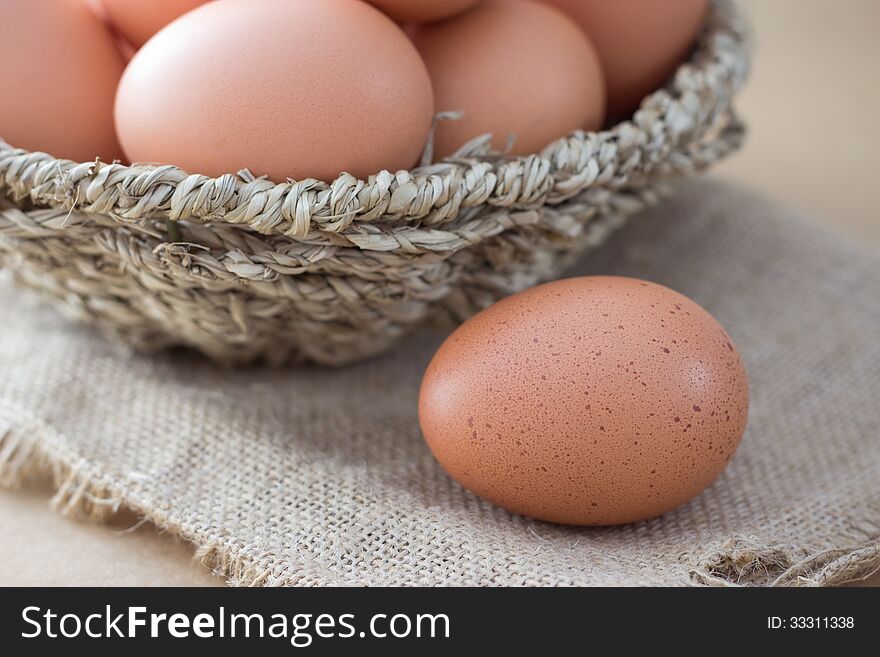 Basket with eggs on sackcloth