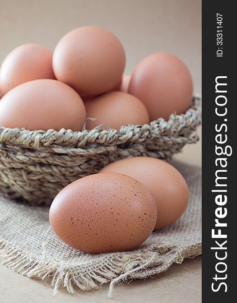 Basket with eggs on sackcloth