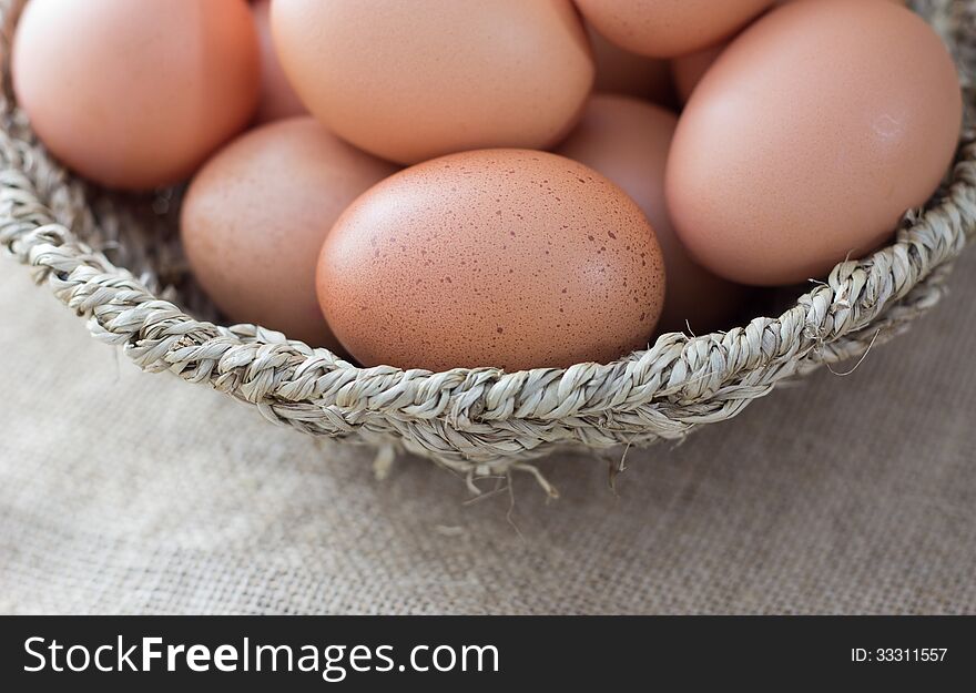 Basket with eggs on sackcloth