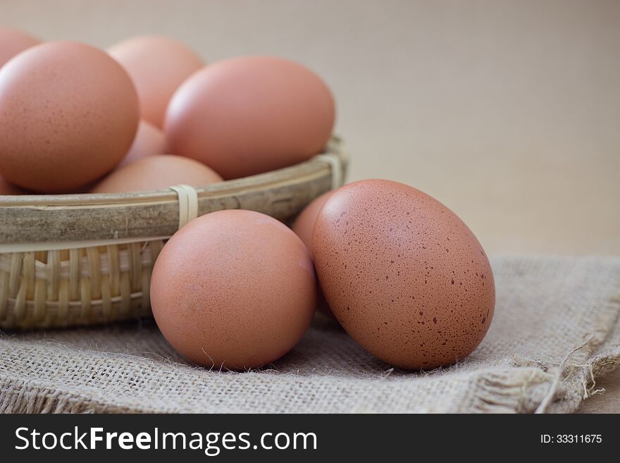 Basket with eggs on sackcloth