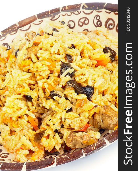 Traditional Asian Pilau with Meat, Barberry and Carrot closeup on Variegated Plate