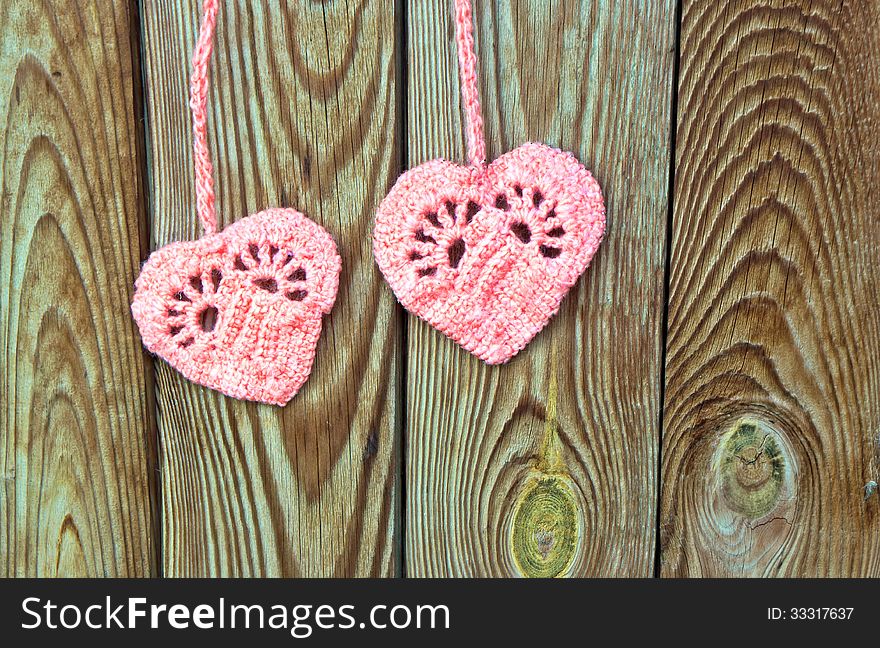 Two crocheted hearts as a symbol of love. Two crocheted hearts as a symbol of love