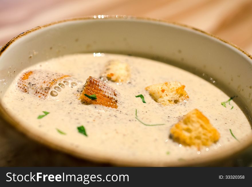 Bowl of hot mushroom soup with croutons. Bowl of hot mushroom soup with croutons