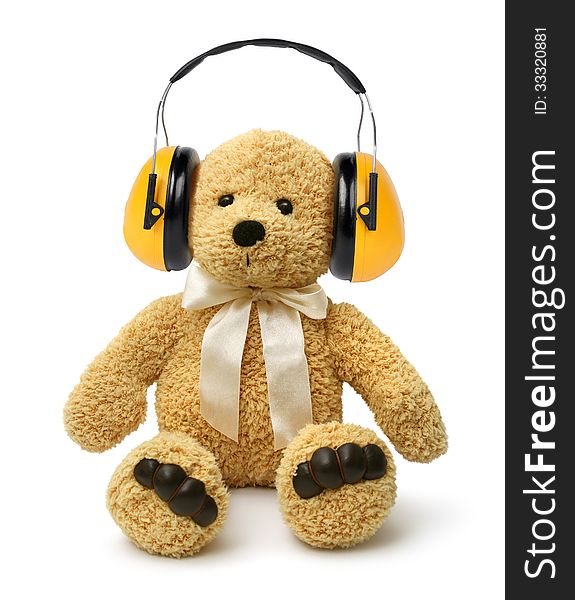 Teddy bear sitting with earmuffs, child abuse concept. Teddy bear sitting with earmuffs, child abuse concept