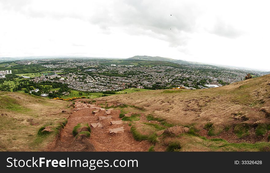 Arthur's Seat is the main peak of the group of hills which form most of Holyrood Park. It is situated in the centre of the city of Edinburgh, about a mile to the east of Edinburgh Castle. The hill rises above the city to a height of 250.5 m (822 ft), provides excellent panoramic views of the city, is relatively easy to climb, and is popular for hillwalking. Arthur's Seat is the main peak of the group of hills which form most of Holyrood Park. It is situated in the centre of the city of Edinburgh, about a mile to the east of Edinburgh Castle. The hill rises above the city to a height of 250.5 m (822 ft), provides excellent panoramic views of the city, is relatively easy to climb, and is popular for hillwalking.