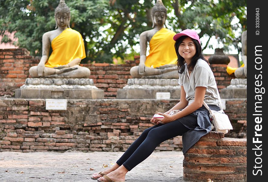 Beautiful girl and buddha at Wat Yai Chai Mongkol Temple. Ayutth