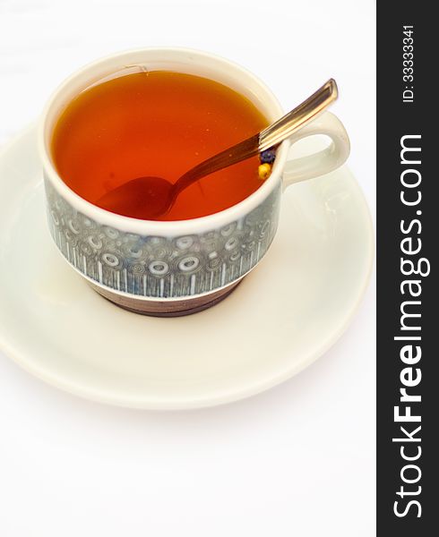 Warm rooibos and spices tea in a porcelain cup. Warm rooibos and spices tea in a porcelain cup