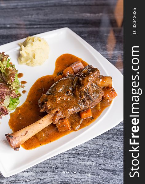 Grilled German pig leg with black pepper sauce