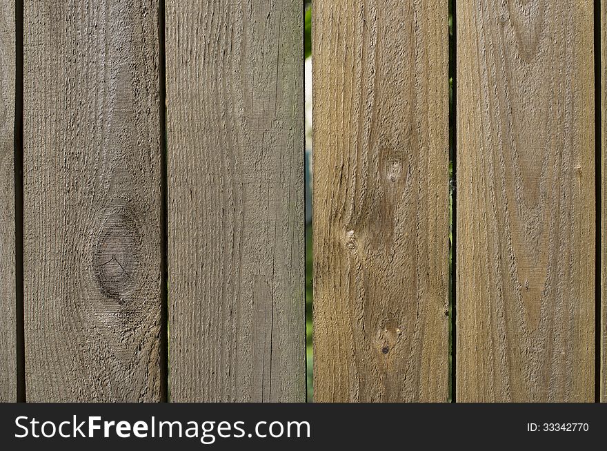 Wooden fence with a look-through slit. Wooden fence with a look-through slit