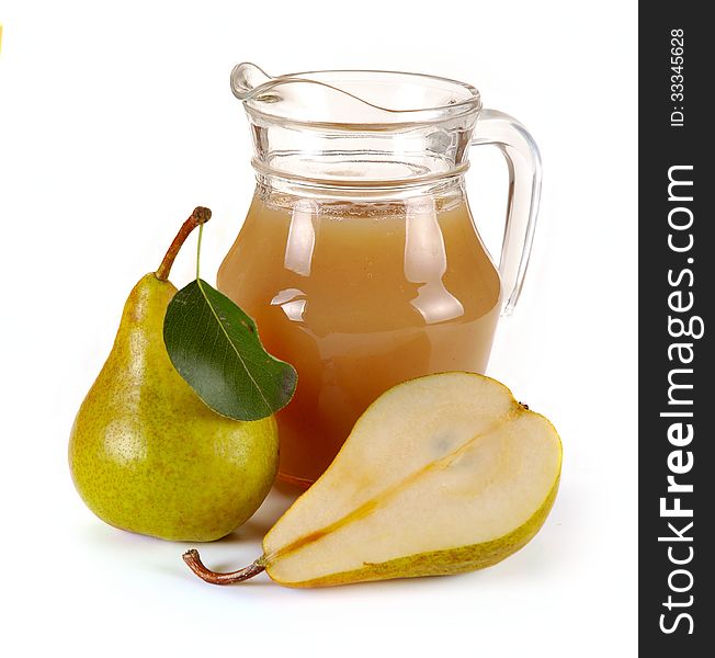 Pear juice in a jug and a glass of fruit. Pear juice in a jug and a glass of fruit