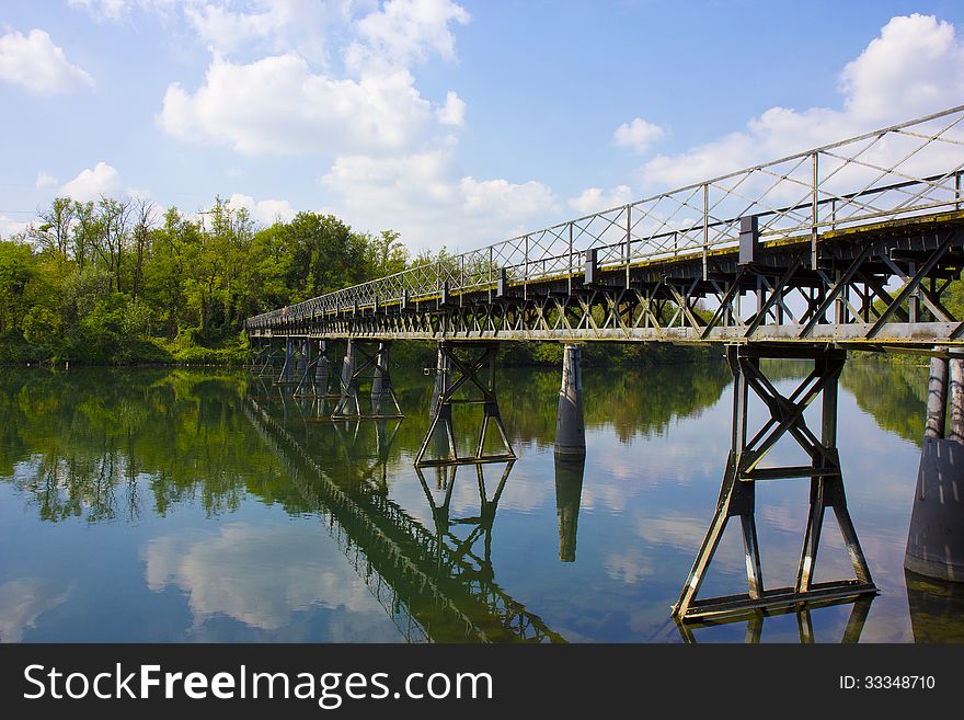 Bridge over calm waters, Fara Gera d'Adda (BG), Italy. Bridge over calm waters, Fara Gera d'Adda (BG), Italy