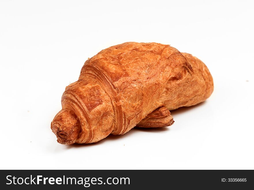 Fresh croissant on a white background