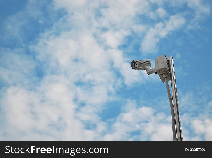CCTV camera high view with blue sky close up