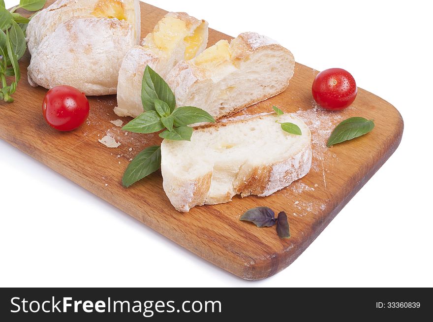 Cutted White Bread With Cheese On The Wooden Board, With Tomatos And Basil