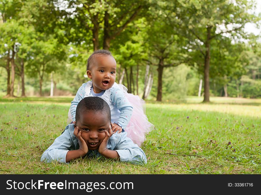 Happy little children are having a nice day in the park. Happy little children are having a nice day in the park