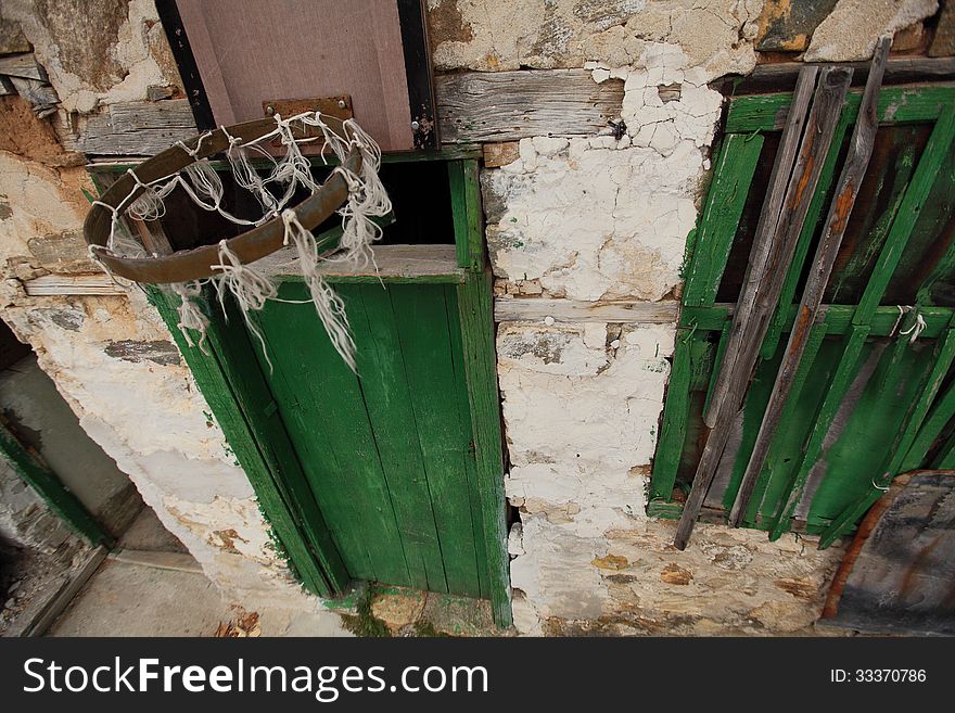Wall of an old house with a basket for basketball. Wall of an old house with a basket for basketball.