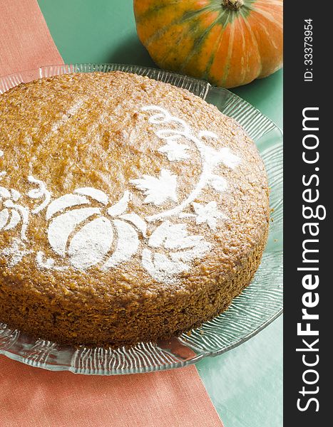 Pumpkin cake on glass plate, vertical format