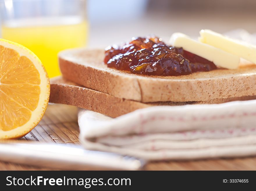 Healthy breakfast with orange jam toast and juice