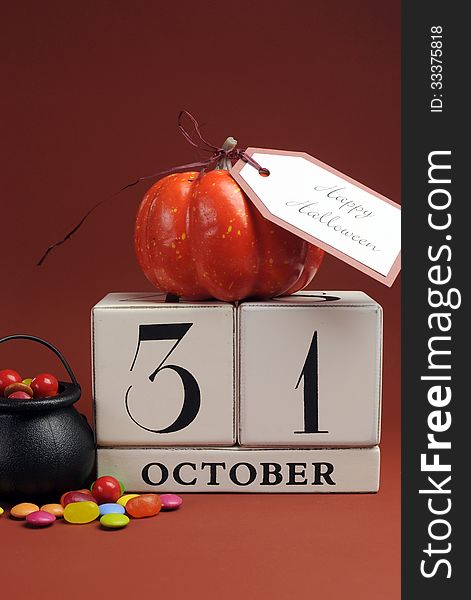 Happy Halloween save the date calendar for October 31 with pumpkin and cauldron candy. Vertical. Happy Halloween save the date calendar for October 31 with pumpkin and cauldron candy. Vertical
