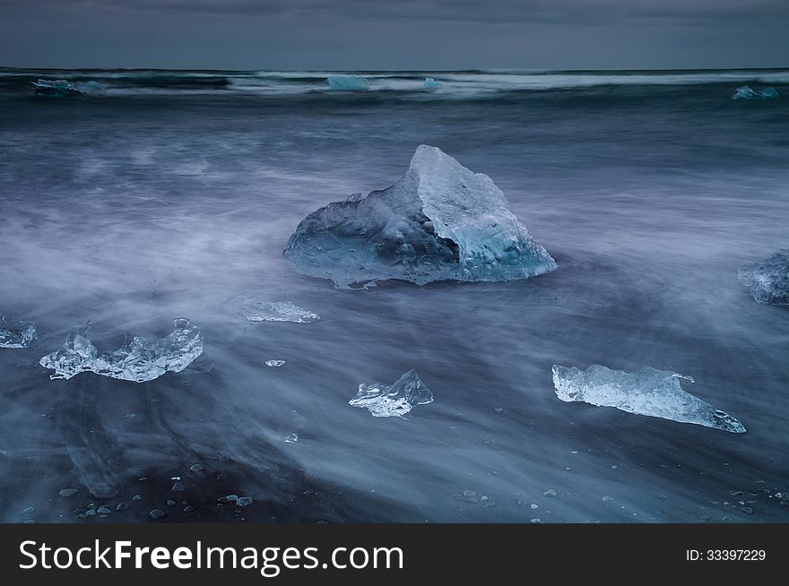 Seashore with glaciers from the Jokulsarlon lagoon, southern Iceland. Photo was taken with long exposure. Seashore with glaciers from the Jokulsarlon lagoon, southern Iceland. Photo was taken with long exposure.
