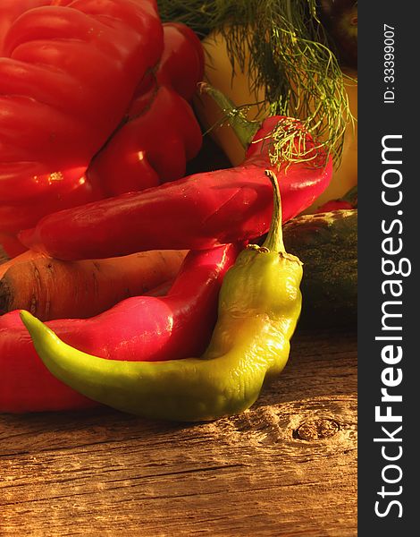 Vegetables on the brown wooden background