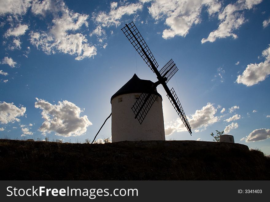 Windmill in LaMancha, Spain, on the summer sky. Windmill in LaMancha, Spain, on the summer sky