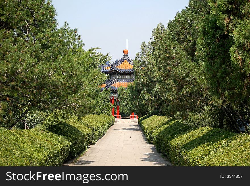 A beautiful pavilion standing among green trees, shot at chinese rose garden in the temple of heaven park. A beautiful pavilion standing among green trees, shot at chinese rose garden in the temple of heaven park.