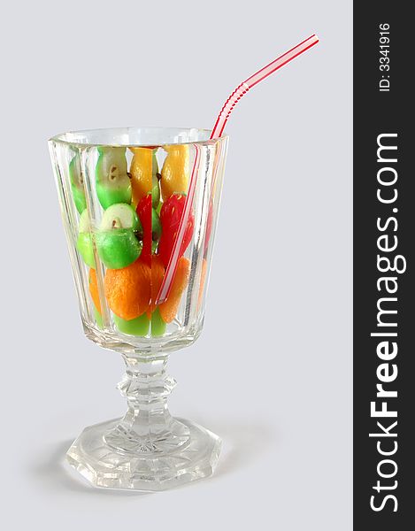 Allegorical fruit cocktail with straw