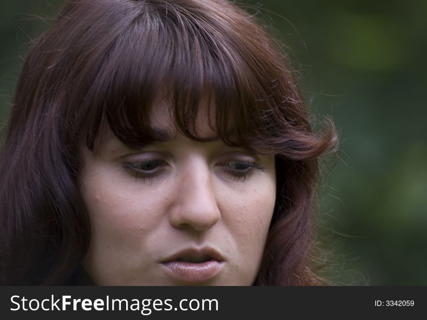 Grieve girl face with brown hair