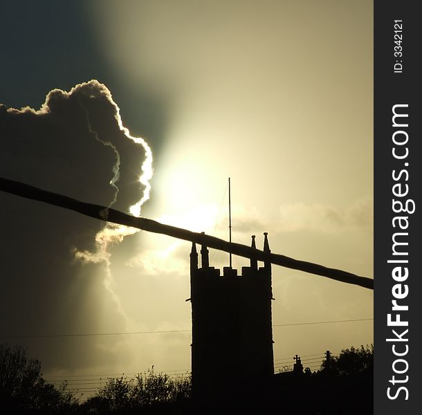 Church Silhoutted By Sun