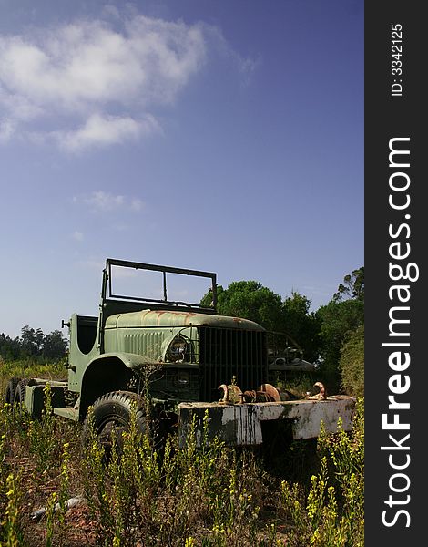 That old car are in midlle of the land. That old car are in midlle of the land