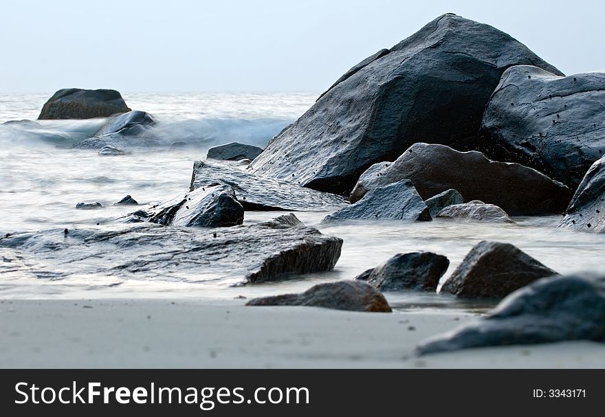 Small waves wash ashore at Allens Pond in Dartmouth, MA, USA. Small waves wash ashore at Allens Pond in Dartmouth, MA, USA