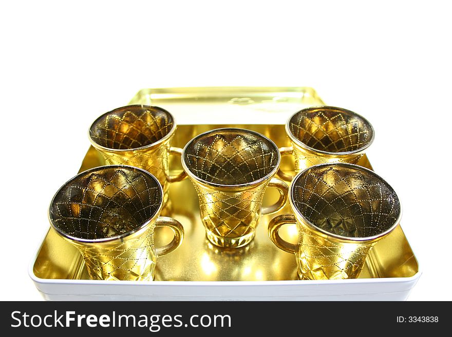Five isolated gilt cups in a box. Five isolated gilt cups in a box