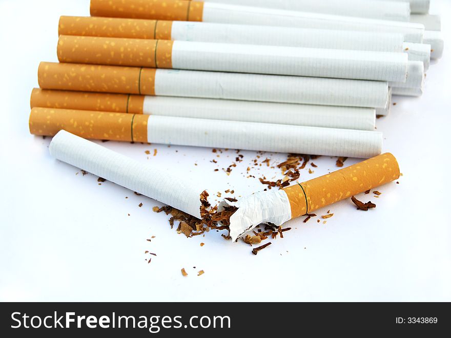 Pack of cigarettes with one broken. Pack of cigarettes with one broken