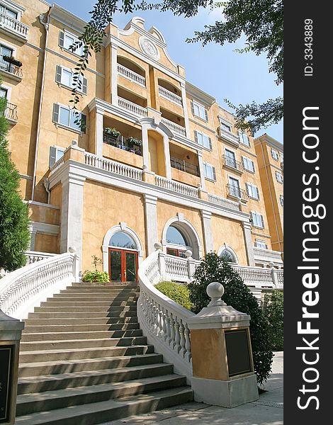 Curved steps rising toward yellow stucco condos. Curved steps rising toward yellow stucco condos