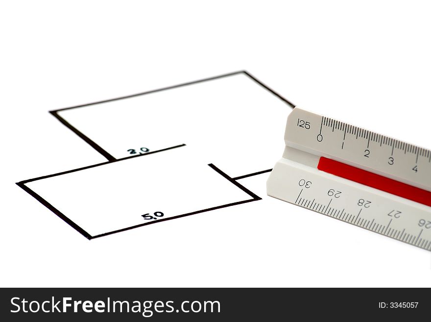 A blueprint and a scale ruler against white background. A blueprint and a scale ruler against white background.