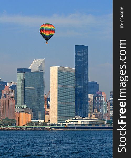 Hot air balloon flying over The United Nations Building in New York City