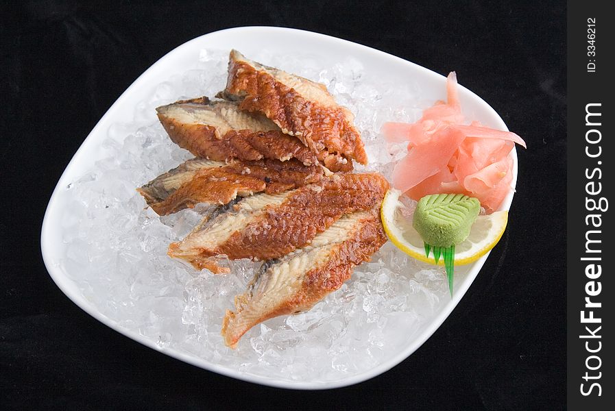Sashimi in ice (isolated in black)