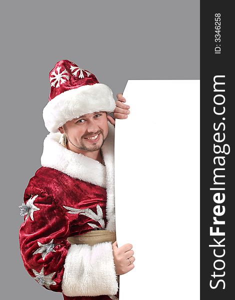 Santa Claus carrying a white paper for advertisement