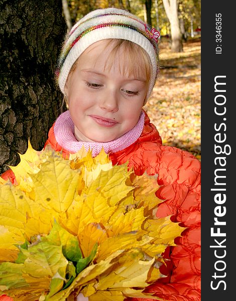 Girl with leafs in hands