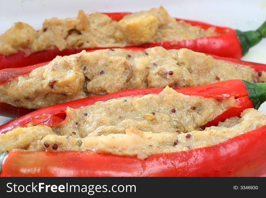 Stuffed chilies with fish korma paste paired with red wine