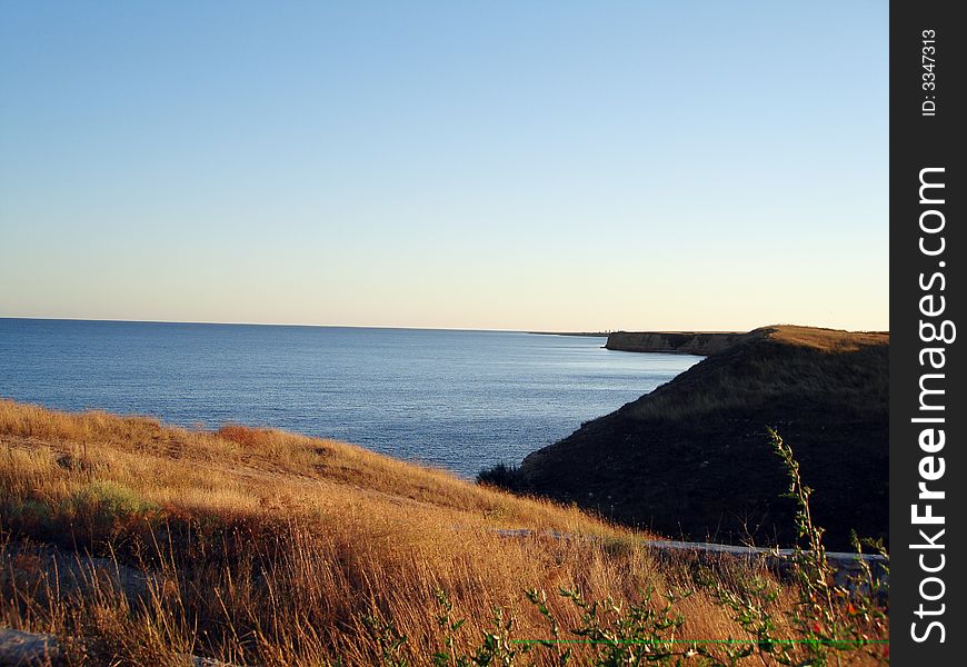 Evening in the sea and meadow